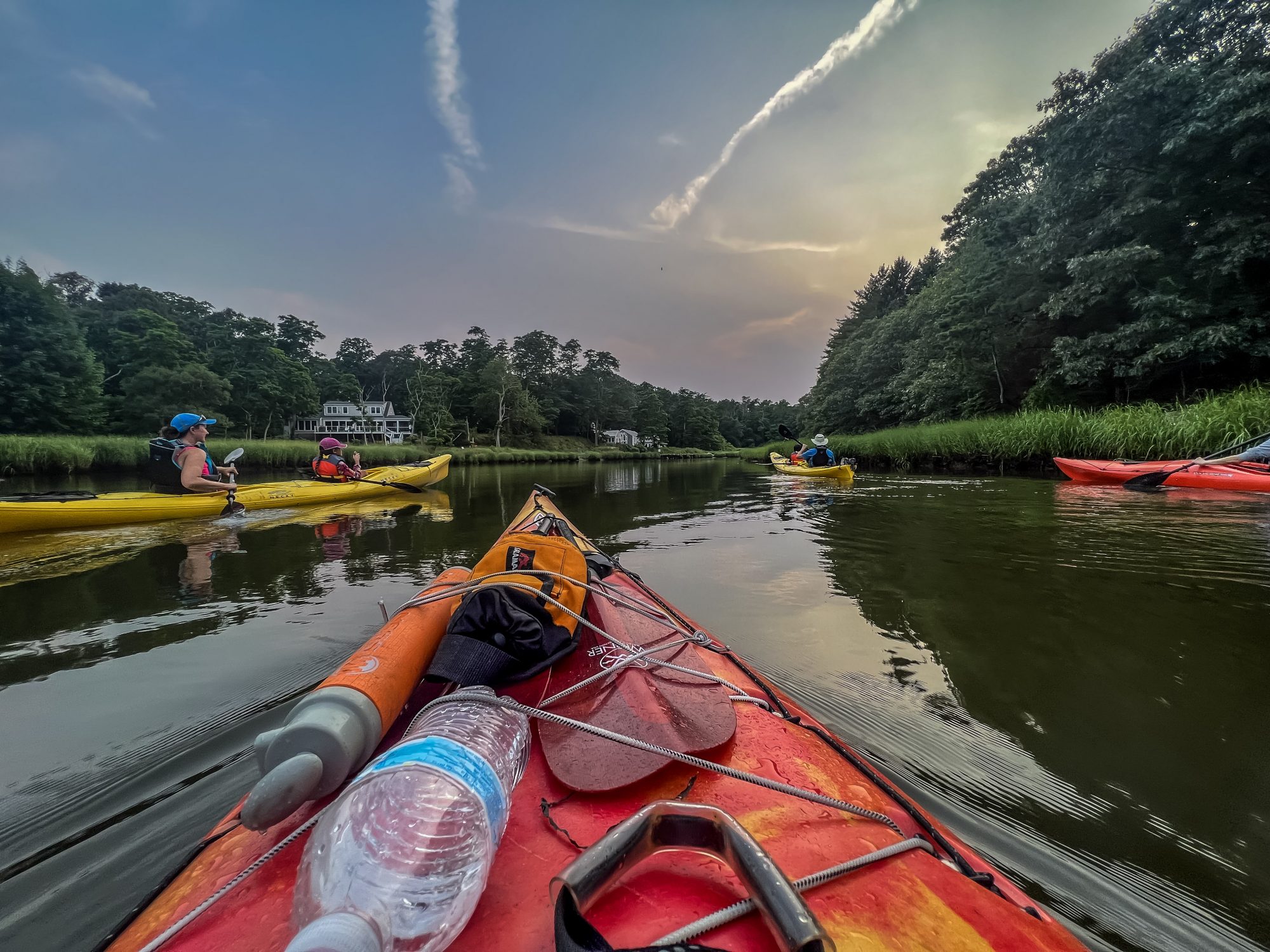 Kayaks on calm river 