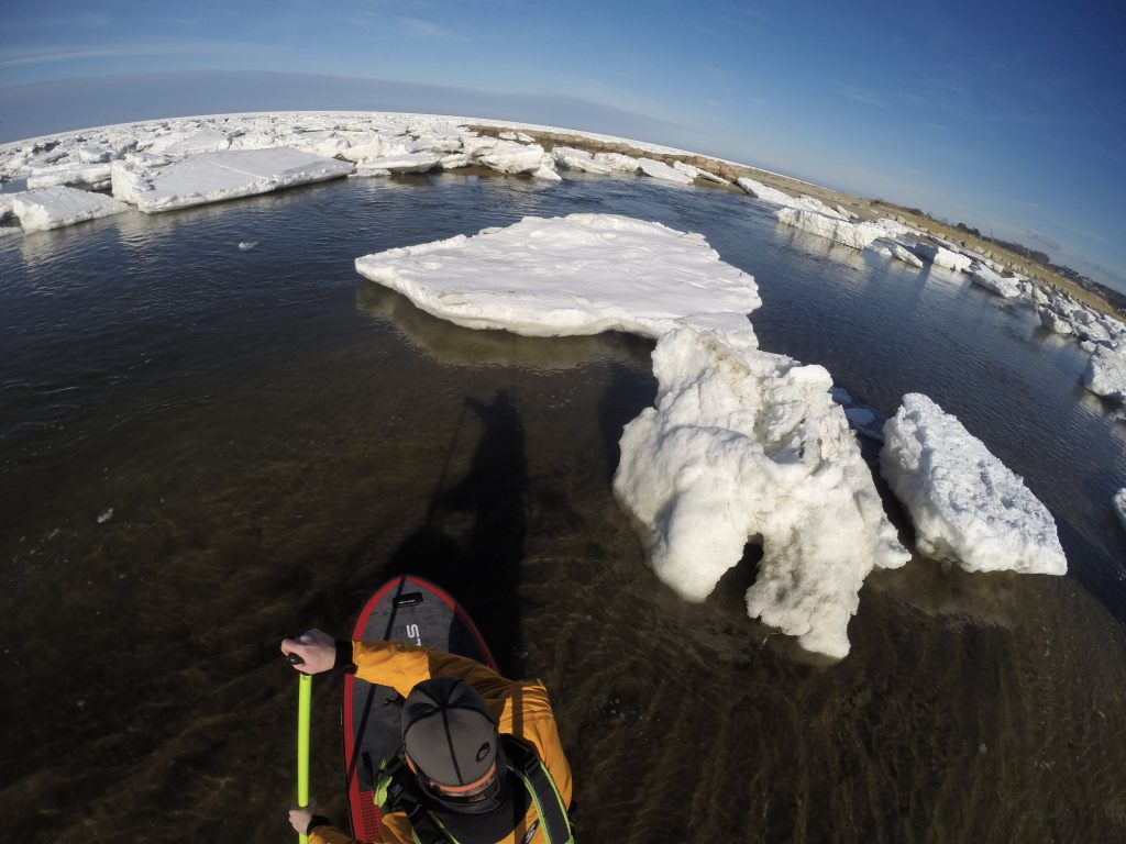 Winter paddling among the ice