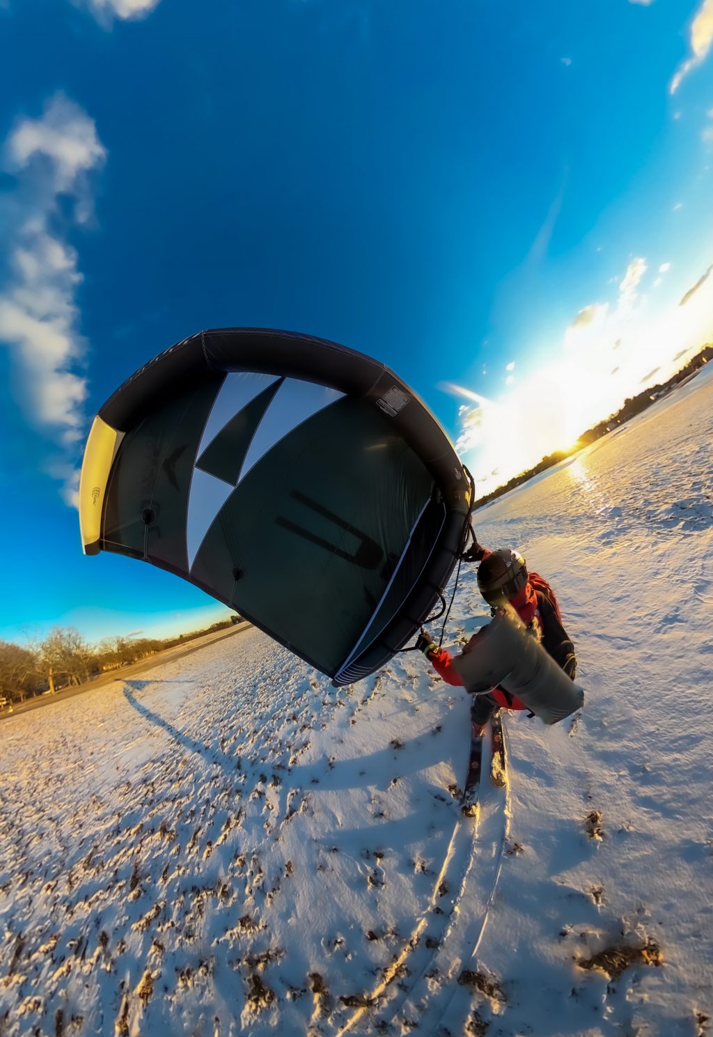 Skiing with a wing at sunset 